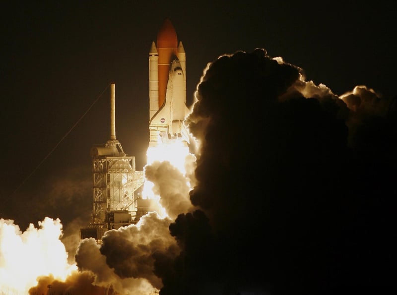 Space shuttle lifting off